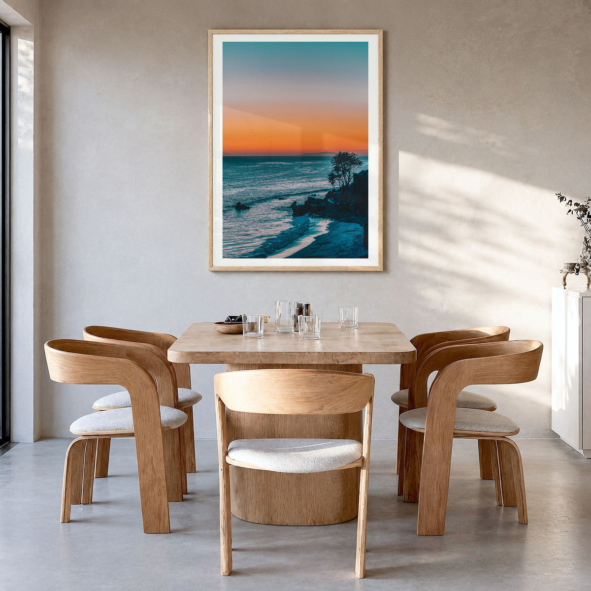 Malibu Photo No 2 Poster in a natural wood frame, hanging in a dining room, white border