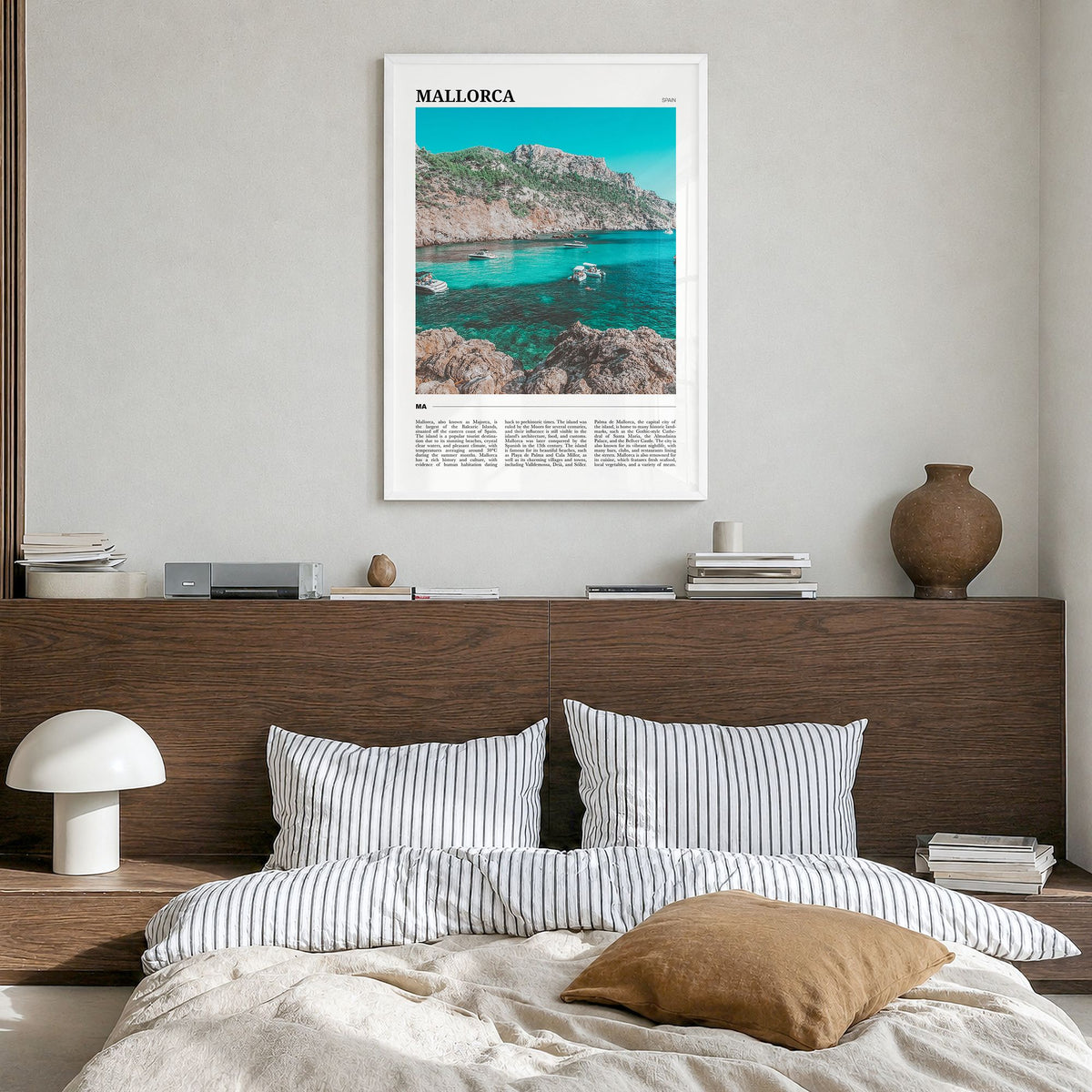 Mallorca Travel Poster in a white wood frame, hanging in a bedroom