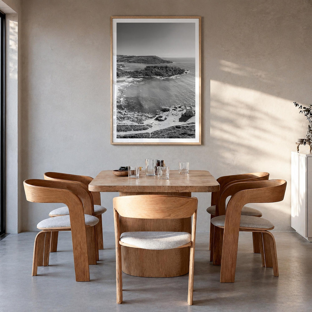 Malta black & white photo poster of Europe – vertical wall art in natural wood frame with white border, hanging on wall