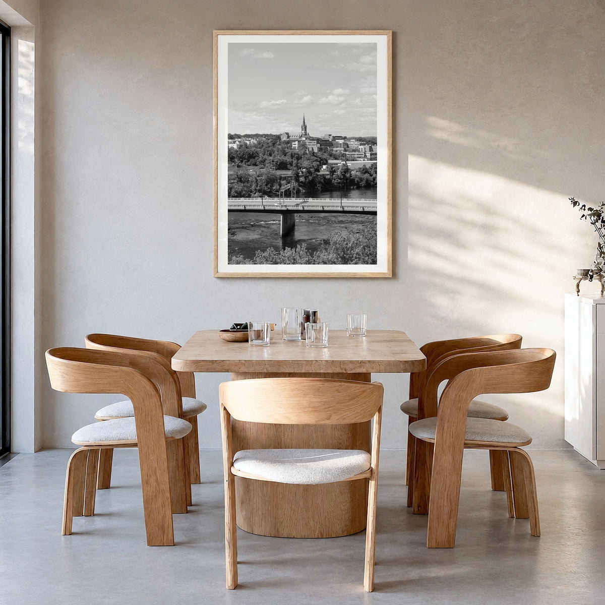 Manchester, New Hampshire Photo Poster in a natural wood frame, hanging in a dining room, white border