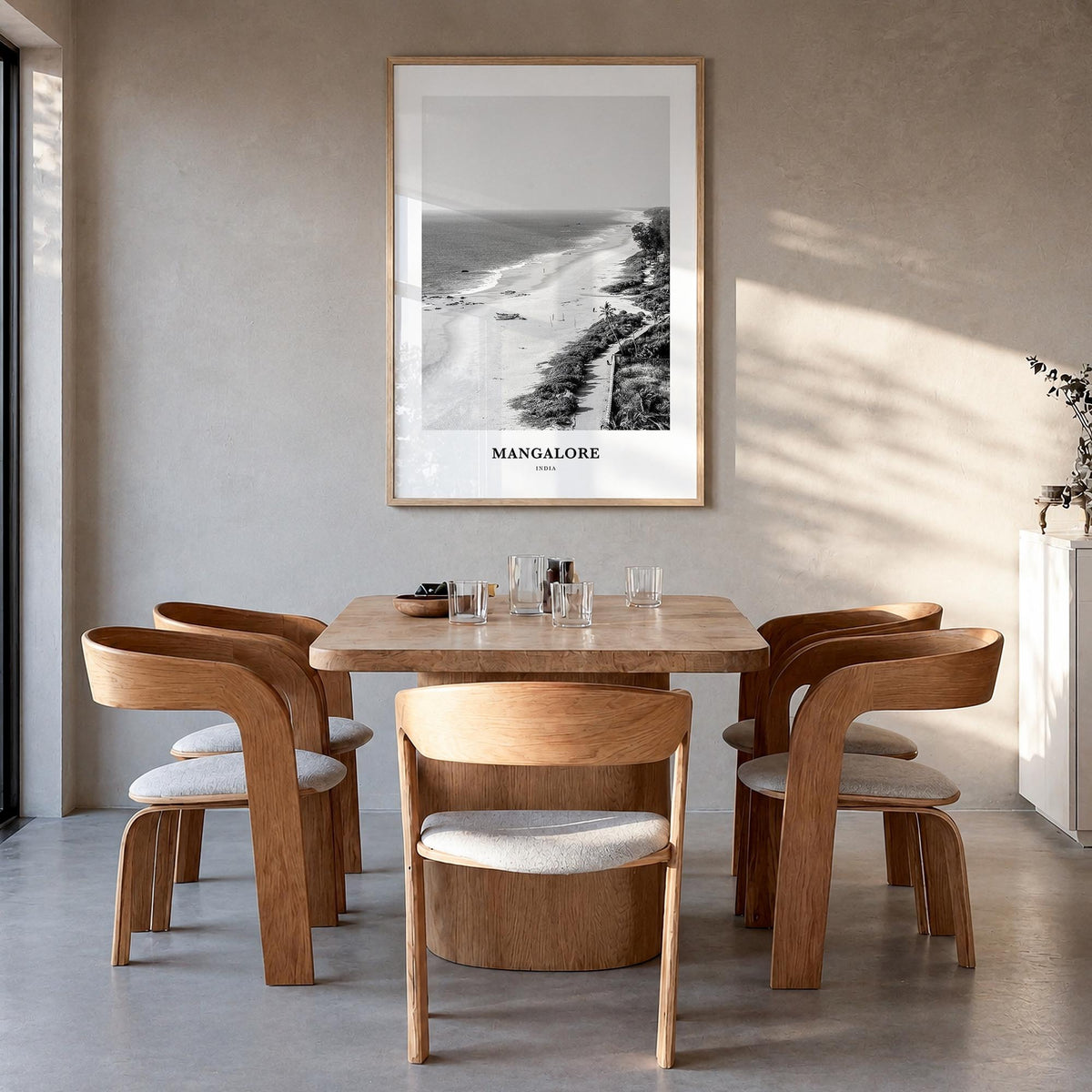 Mangalore black & white classic poster of India – vertical wall art in natural wood frame, hanging on wall