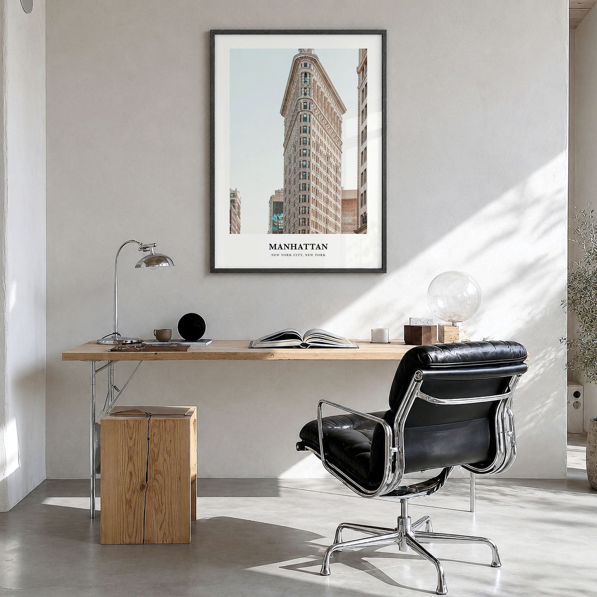 Manhattan Classic Poster in a black wood frame, hanging in a bright home office