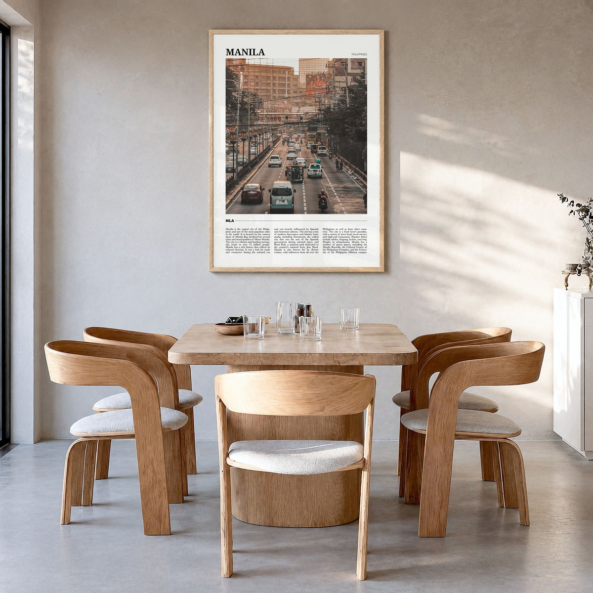 Manila Travel Poster in a natural wood frame, hanging in a dining room