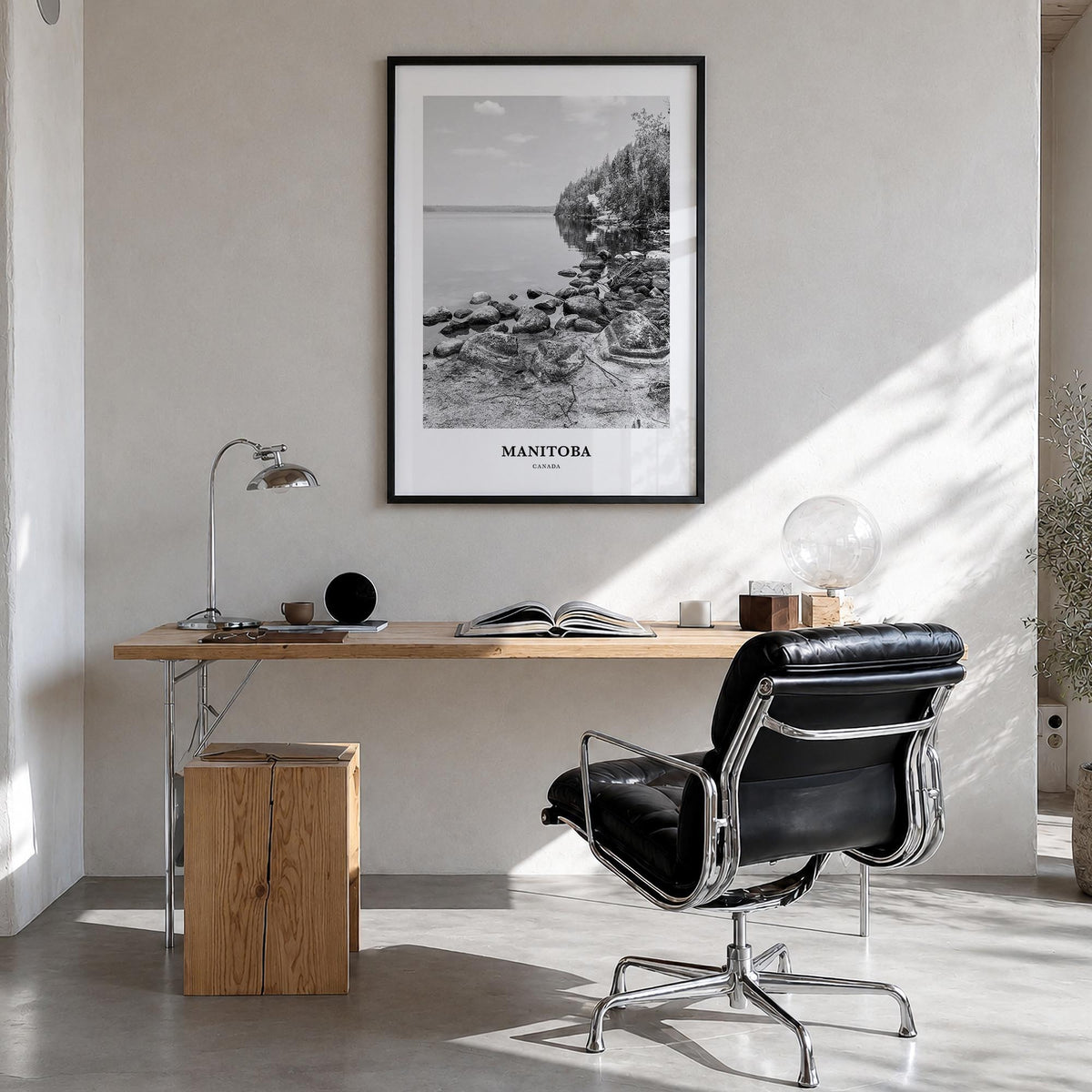 Manitoba black & white classic poster of Canada – vertical wall art in black wood frame, hanging on wall