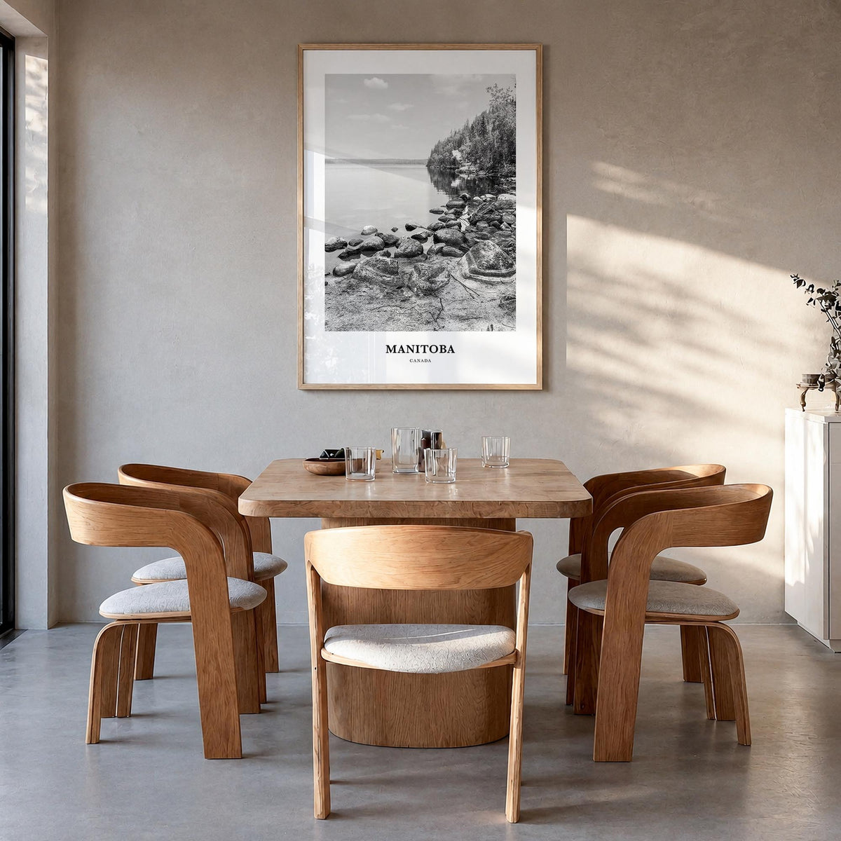 Manitoba black & white classic poster of Canada – vertical wall art in natural wood frame, hanging on wall