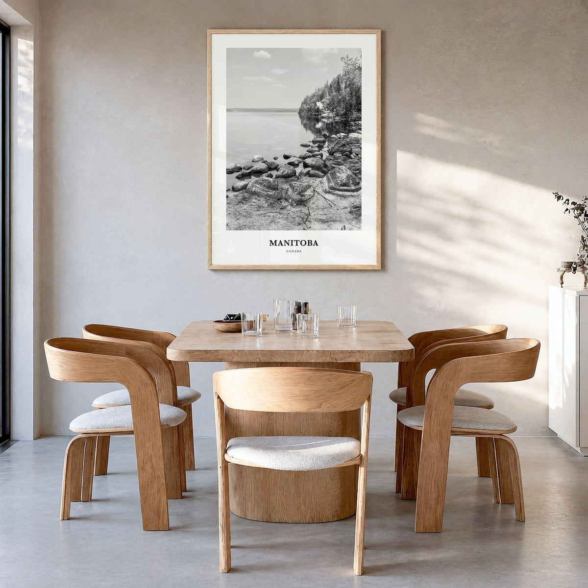 Manitoba Classic Poster in a natural wood frame, hanging in a dining room