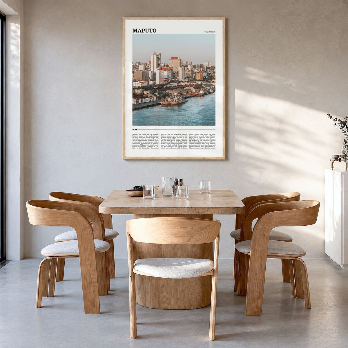 Maputo Travel Poster in a natural wood frame, hanging in a dining room