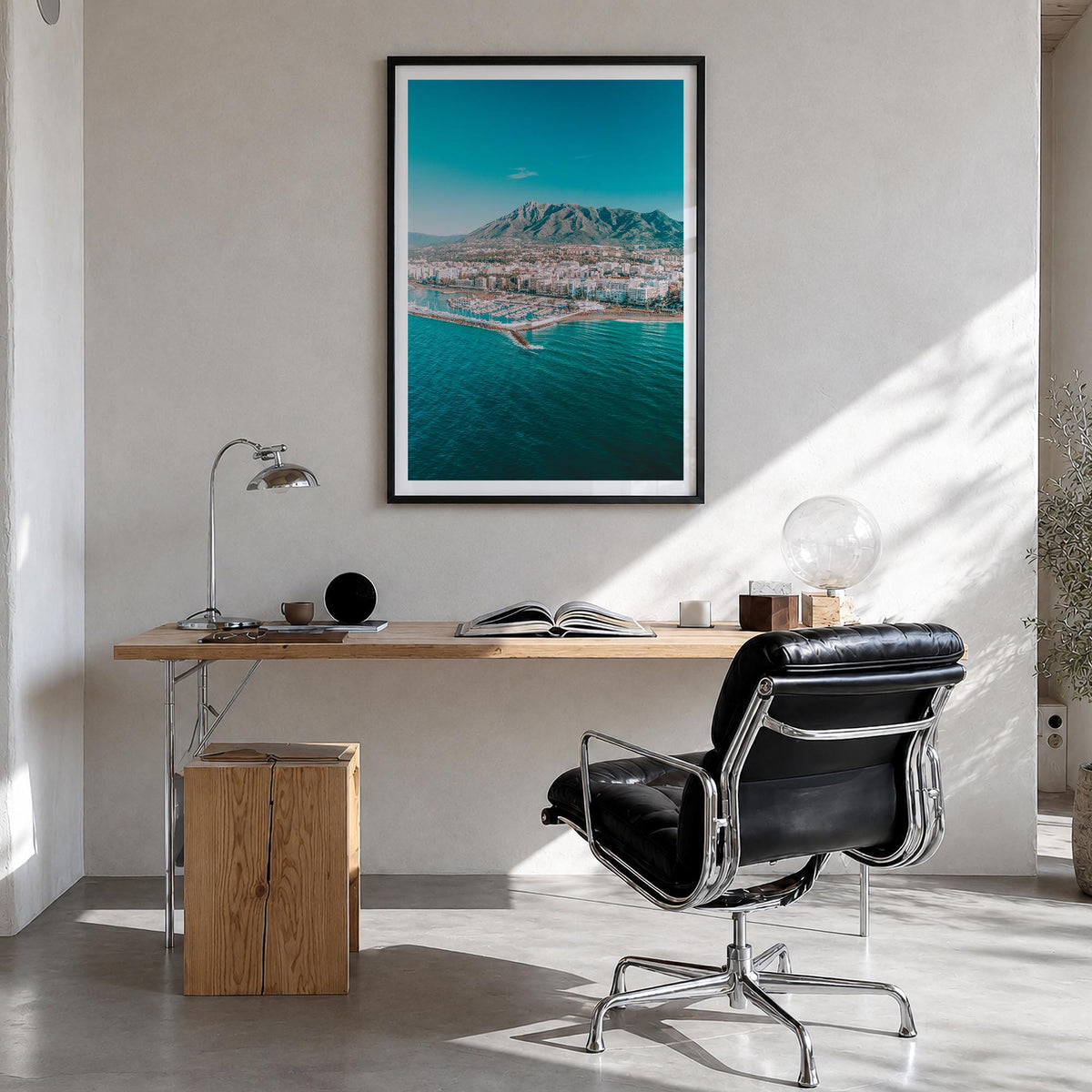 Marbella colorful photo poster of Spain – vertical wall art in black wood frame with white border, hanging on wall