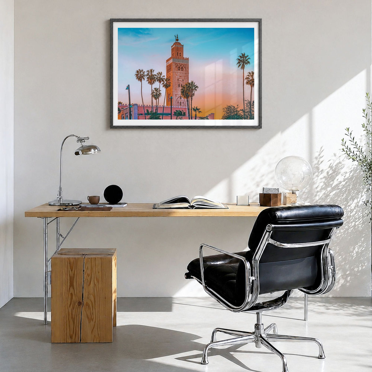 Marrakesh Photo Poster in a black wood frame, hanging in a bright home office, white border