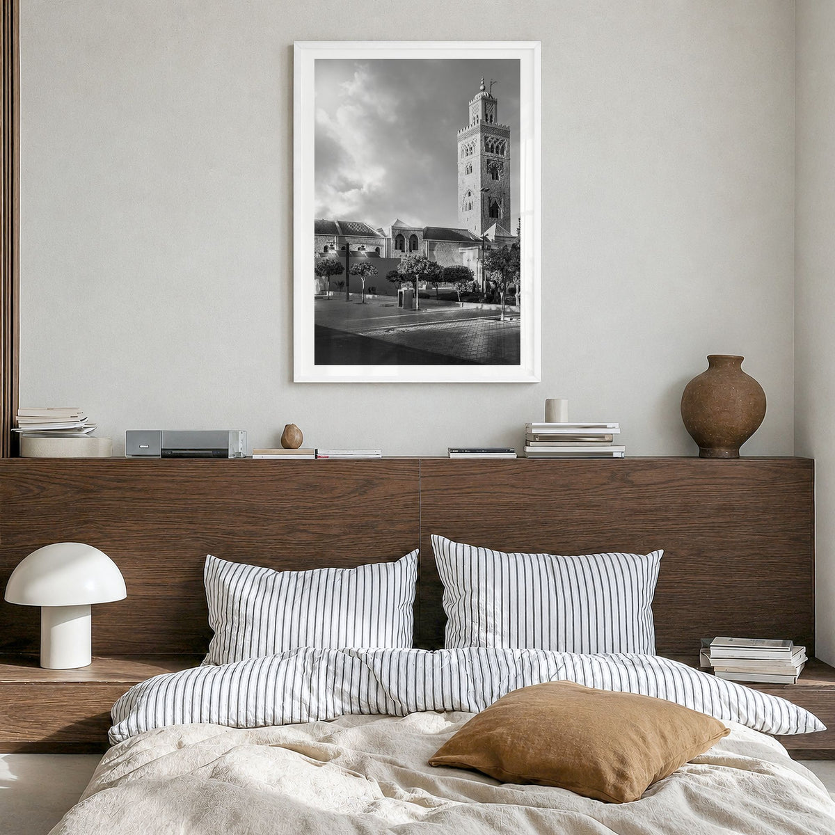 Marrakesh Photo Poster in a white wood frame, hanging in a bedroom, white border