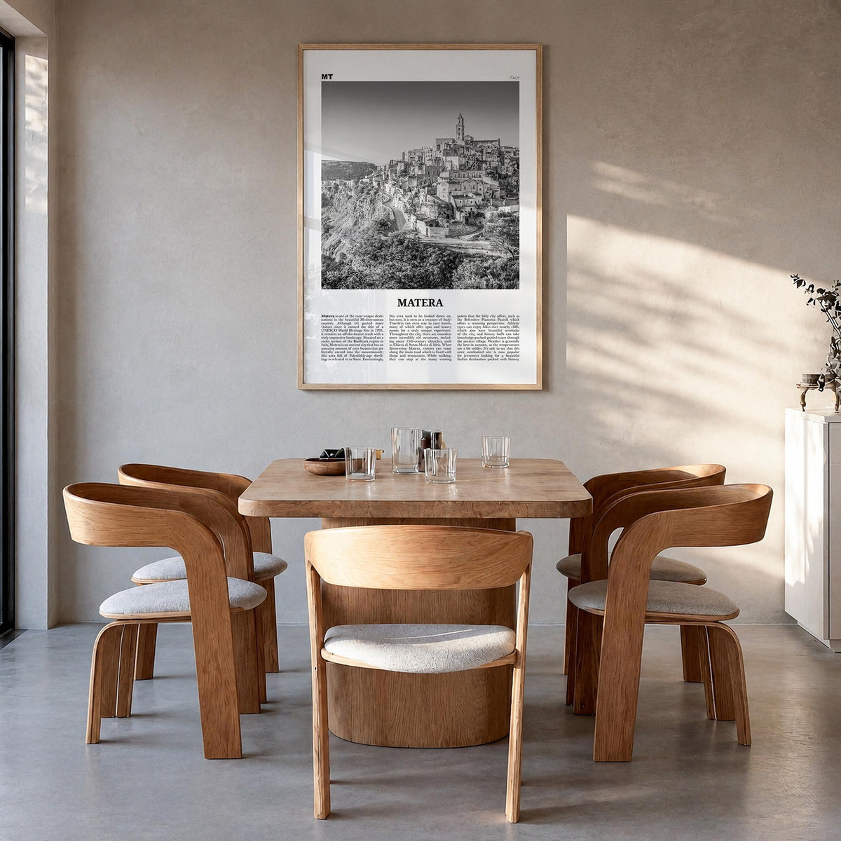 Matera black & white newspaper poster of Italy – vertical wall art in natural wood frame, hanging on wall