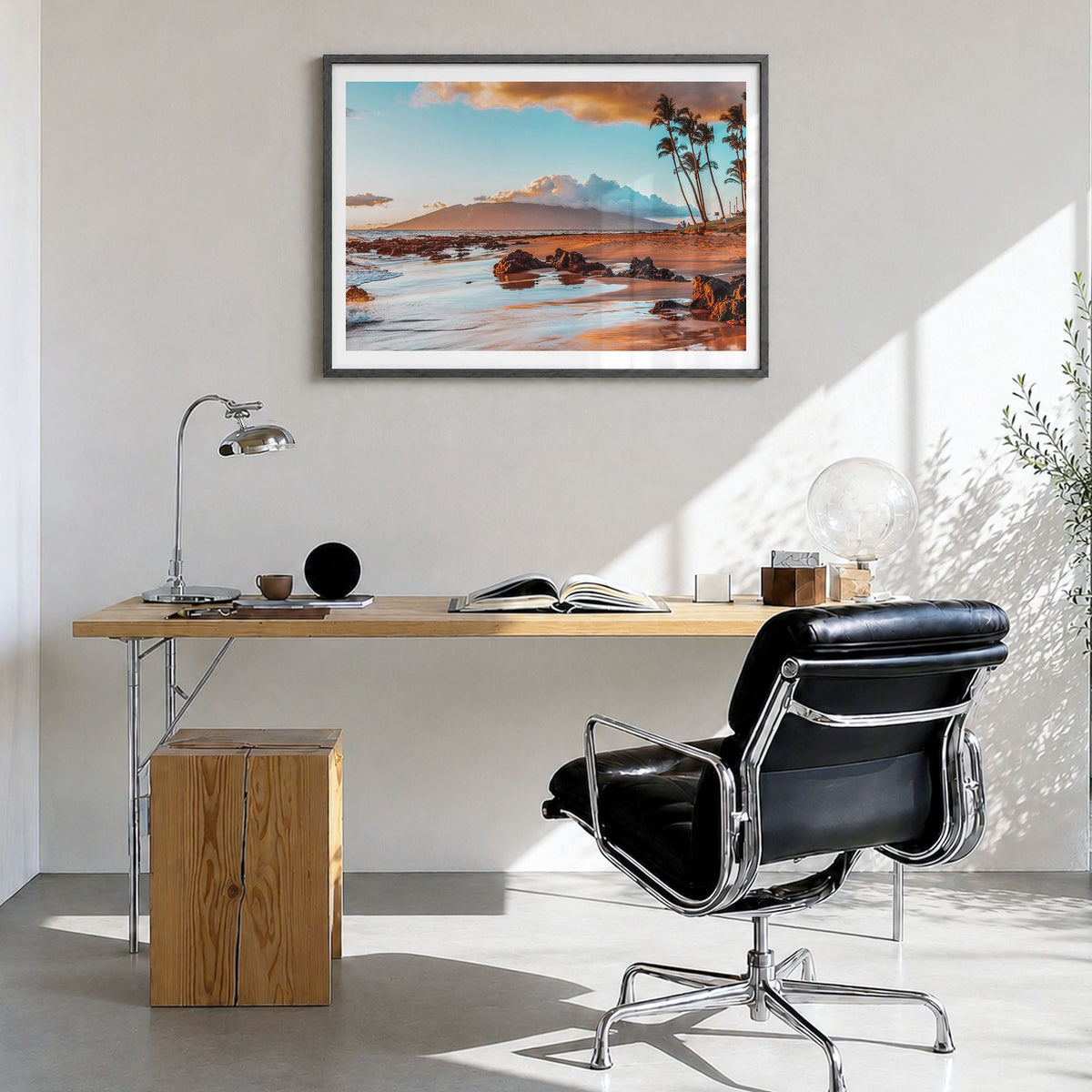 Maui Photo Poster in a black wood frame, hanging in a bright home office, white border