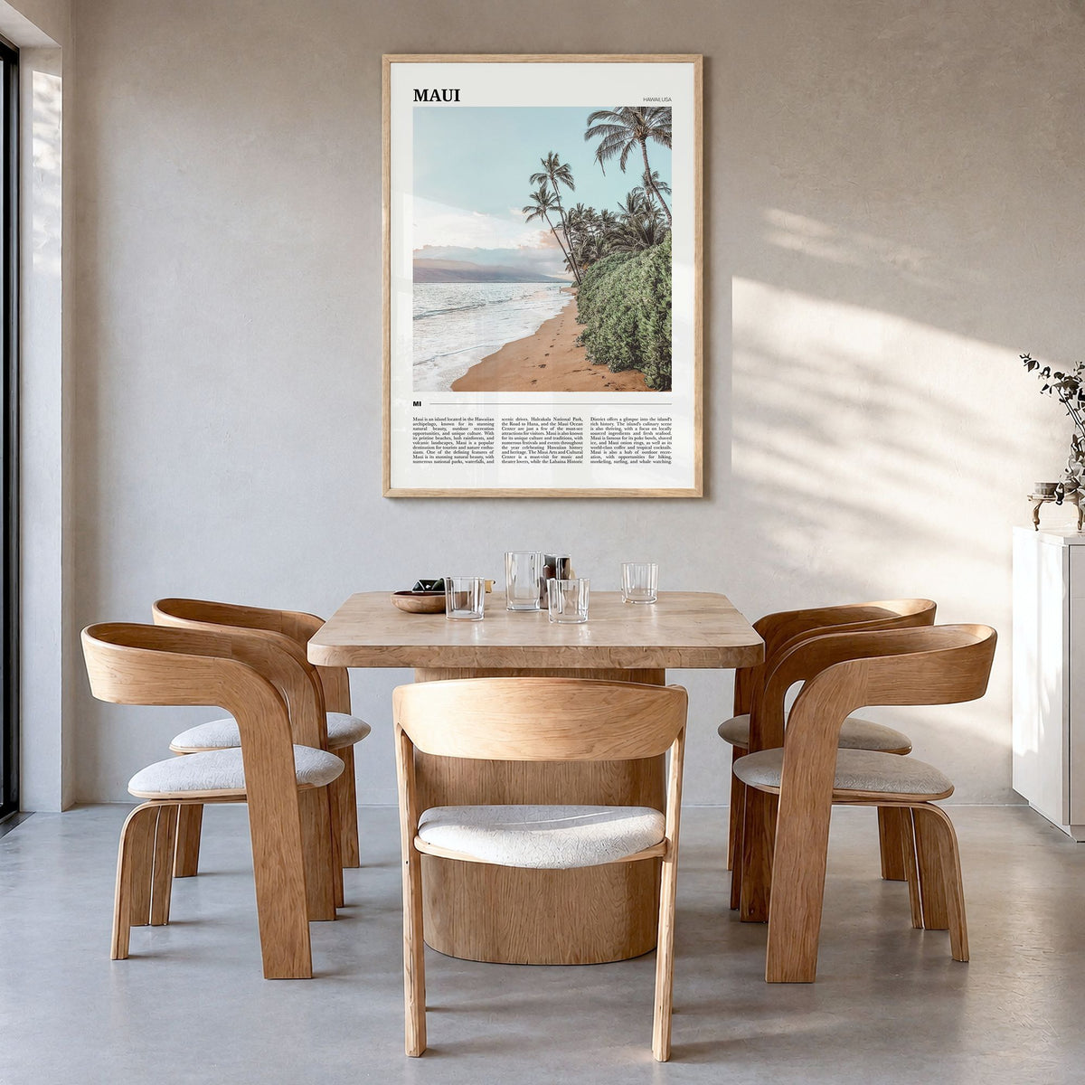 Maui Travel Poster in a natural wood frame, hanging in a dining room