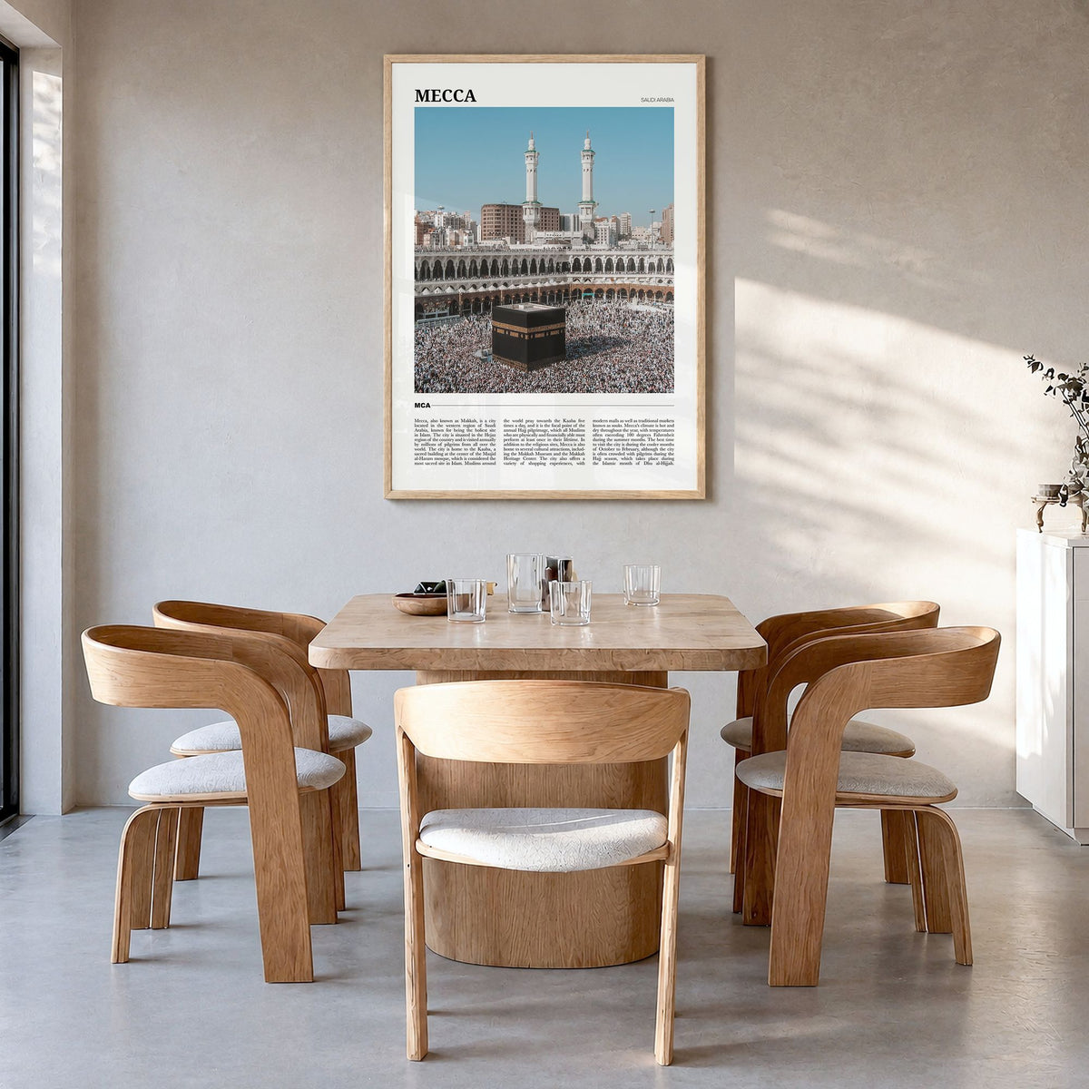 Mecca Travel Poster in a natural wood frame, hanging in a dining room
