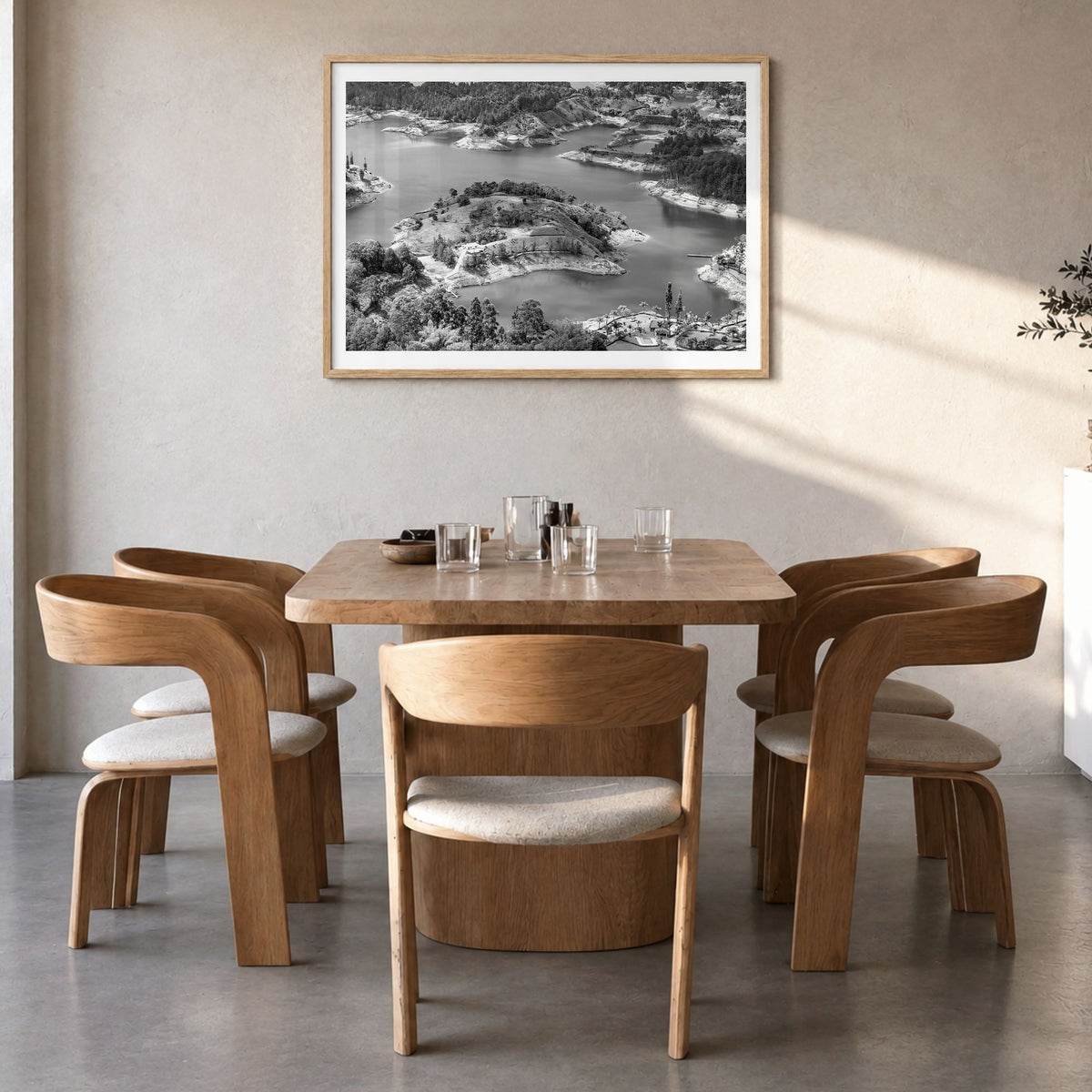 Medellín Photo Poster in a natural wood frame, hanging in a dining room, white border
