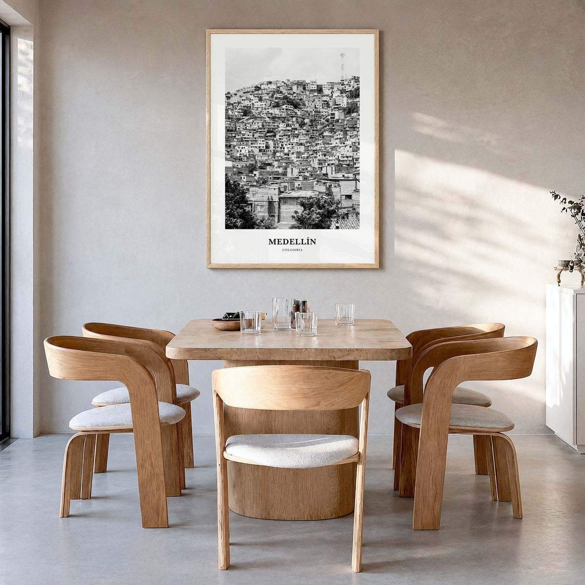 Medellín Classic No 1 Poster in a natural wood frame, hanging in a dining room