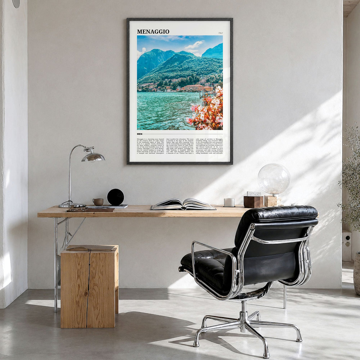 Menaggio Travel Poster in a black wood frame, hanging in a bright home office