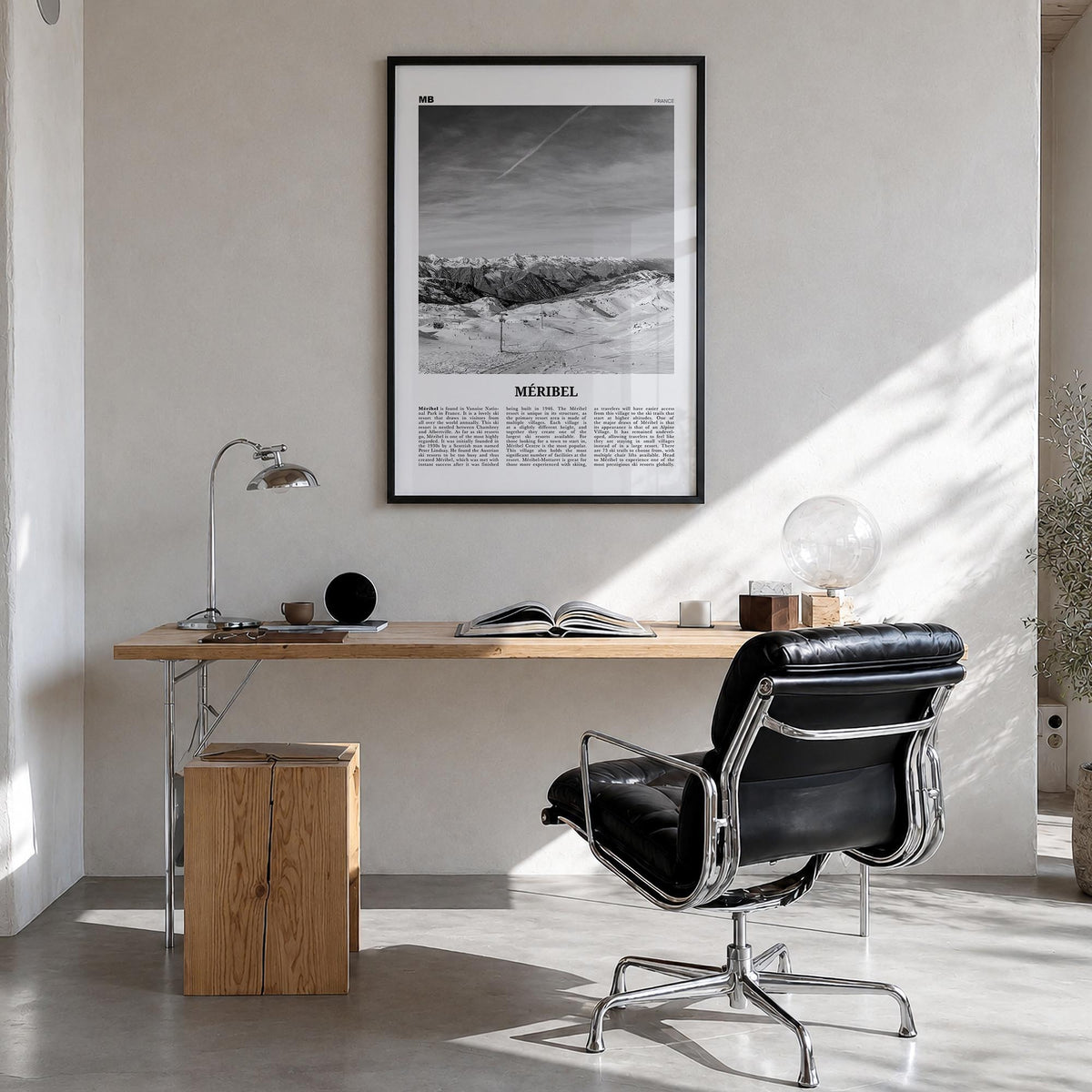Méribel black & white newspaper poster of France – vertical wall art in black wood frame, hanging on wall