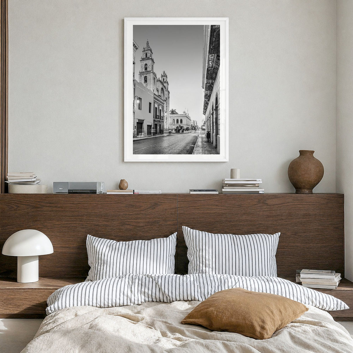 Mérida Photo Poster in a white wood frame, hanging in a bedroom, white border