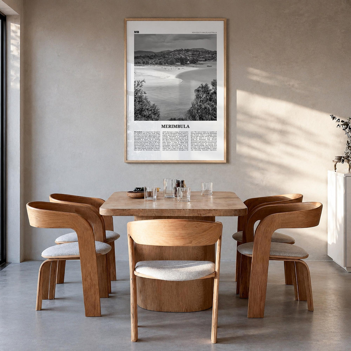 Merimbula black & white newspaper poster of Australia – vertical wall art in natural wood frame, hanging on wall