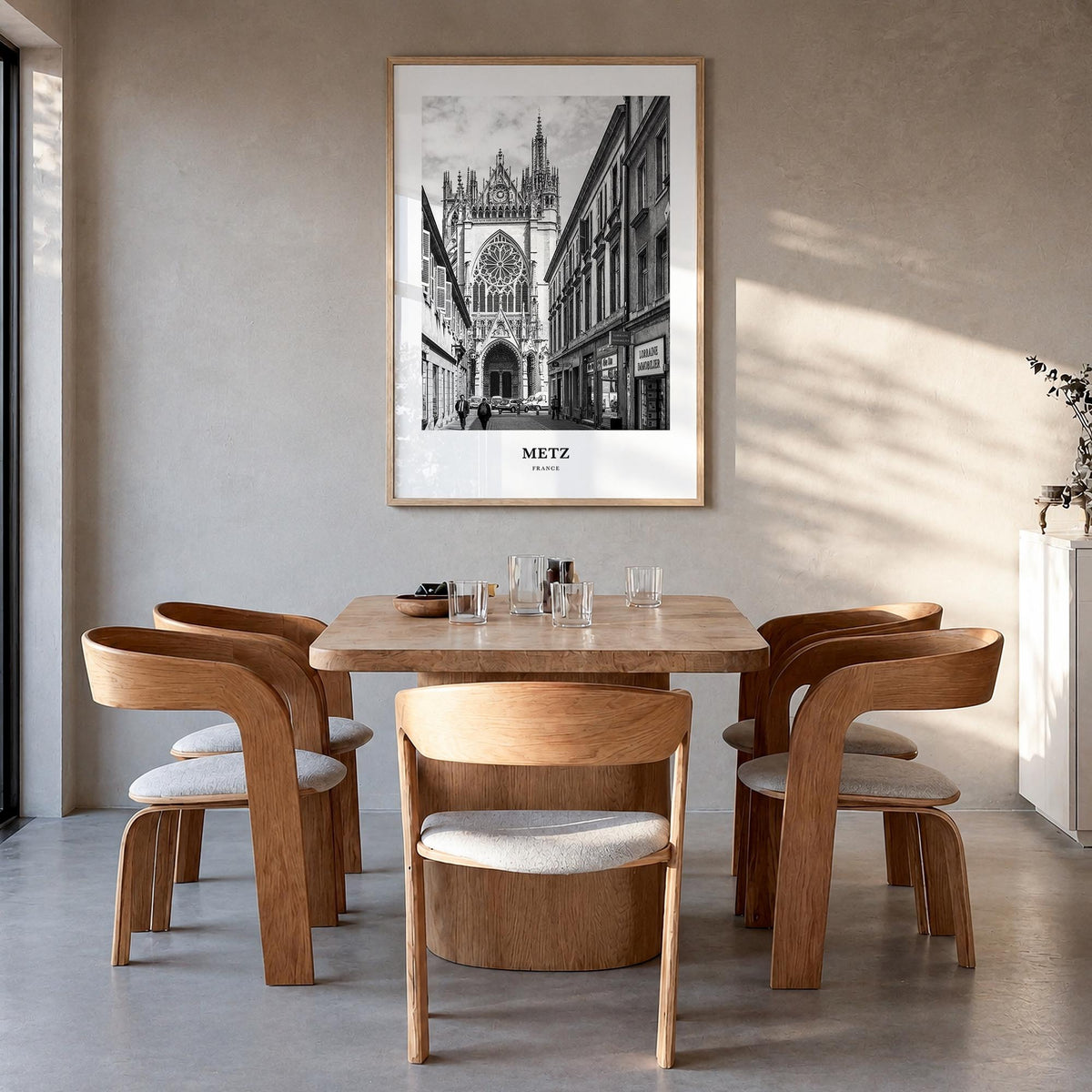 Metz black & white classic poster of France – vertical wall art in natural wood frame, hanging on wall