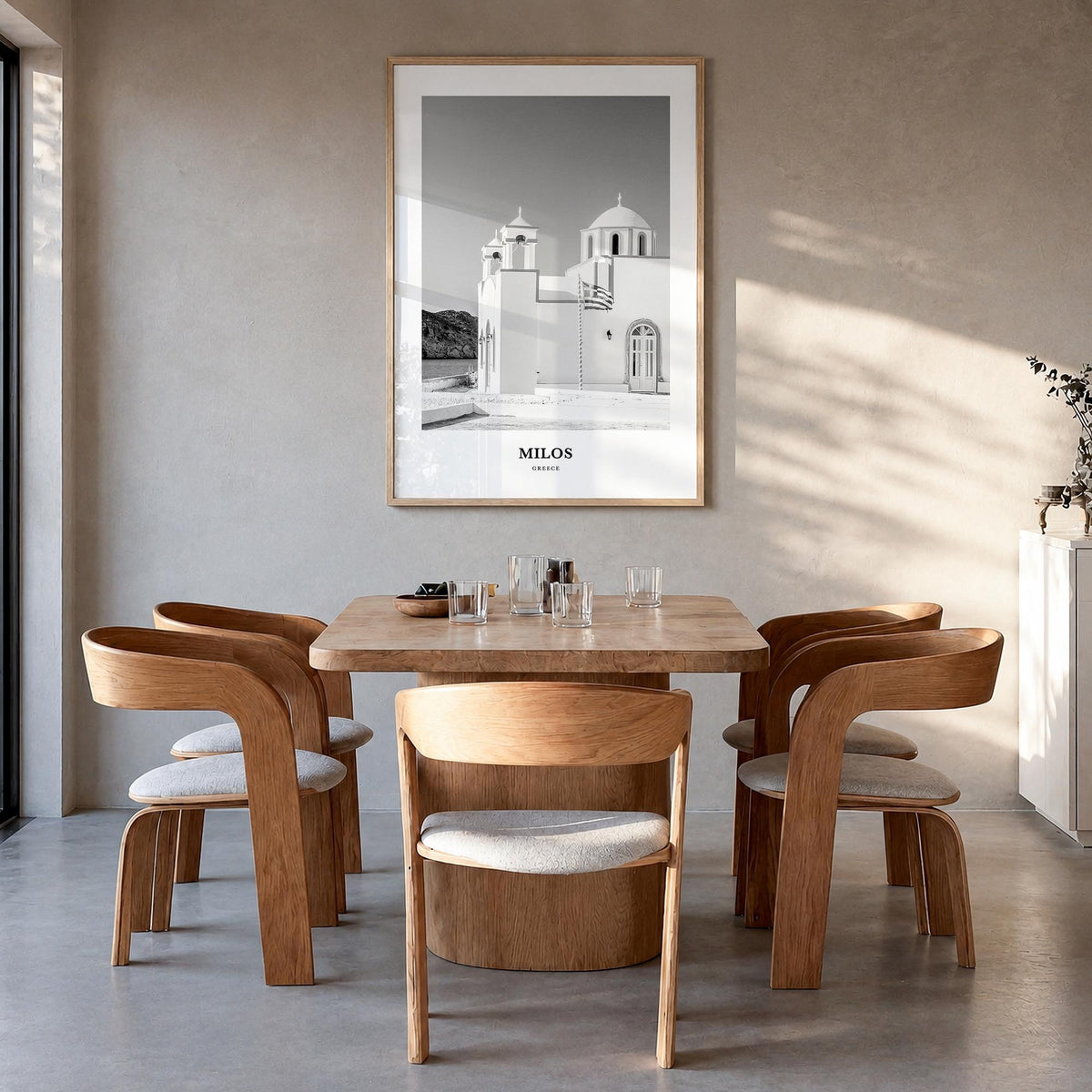 Milos black & white classic poster of Greece – vertical wall art in natural wood frame, hanging on wall