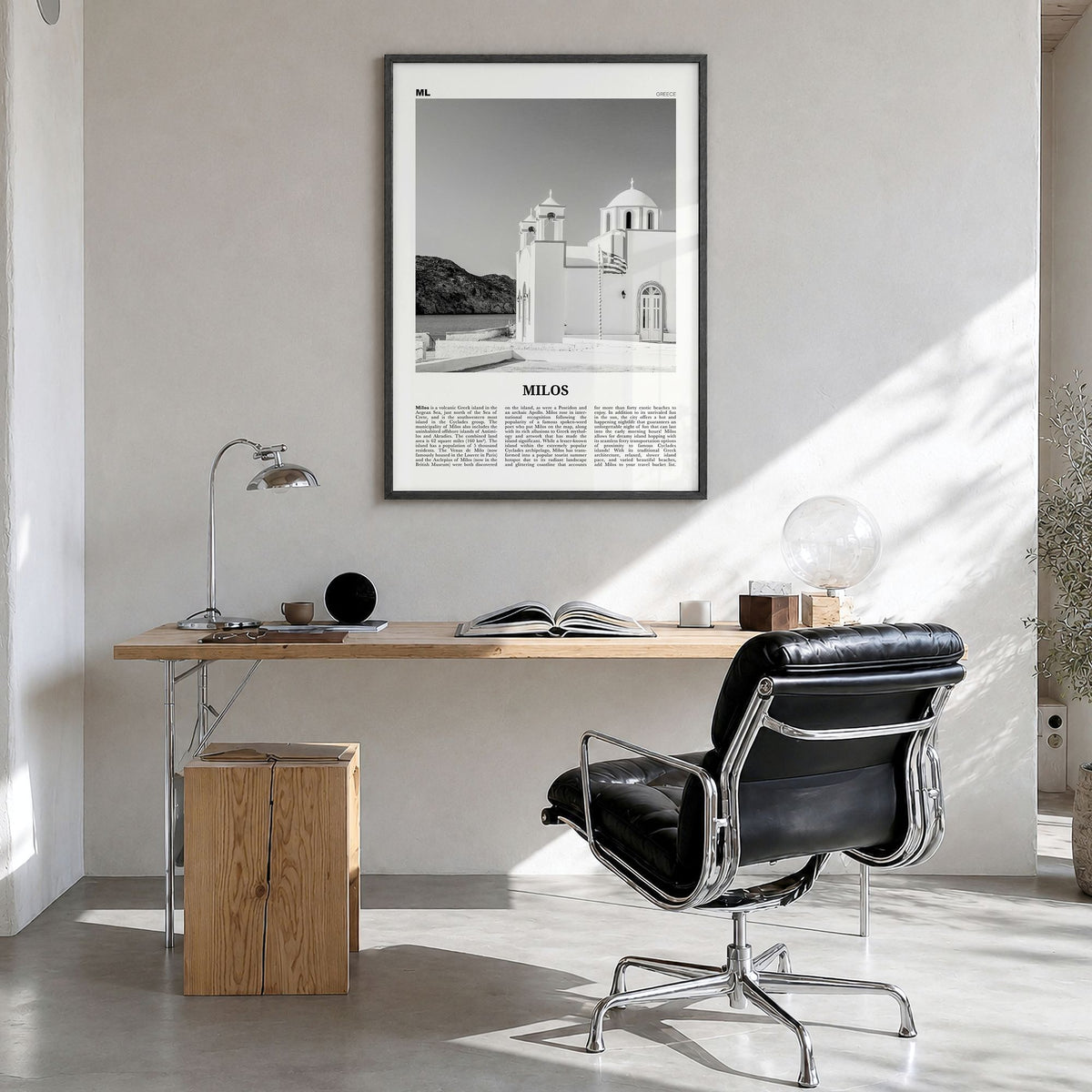 Milos Newspaper Poster in a black wood frame, hanging in a bright home office