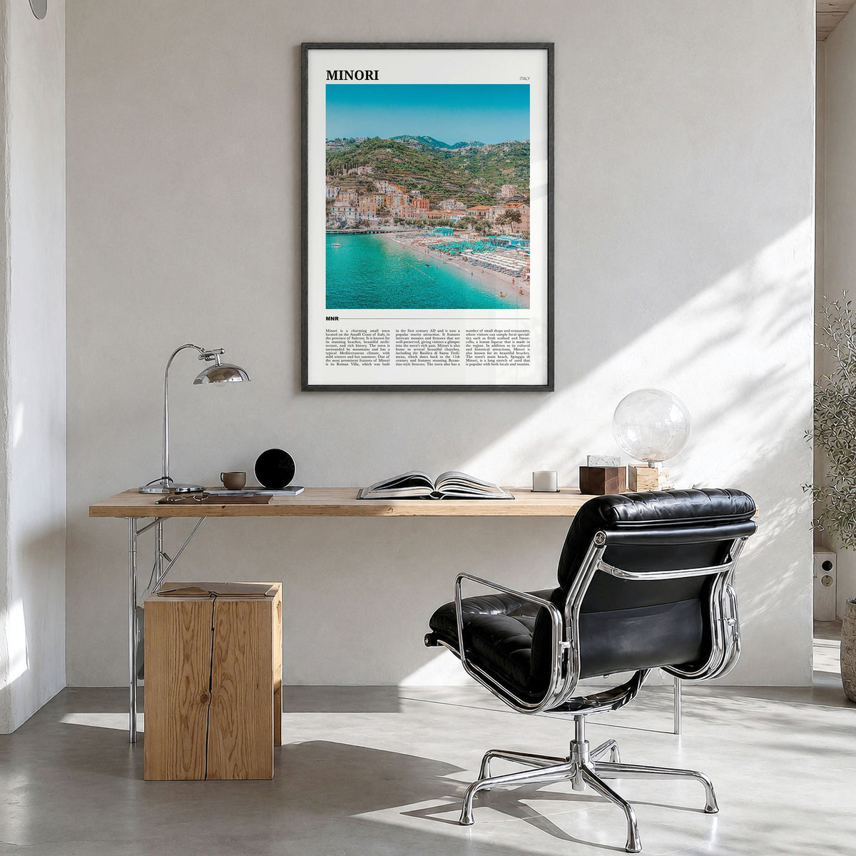 Minori Travel Poster in a black wood frame, hanging in a bright home office