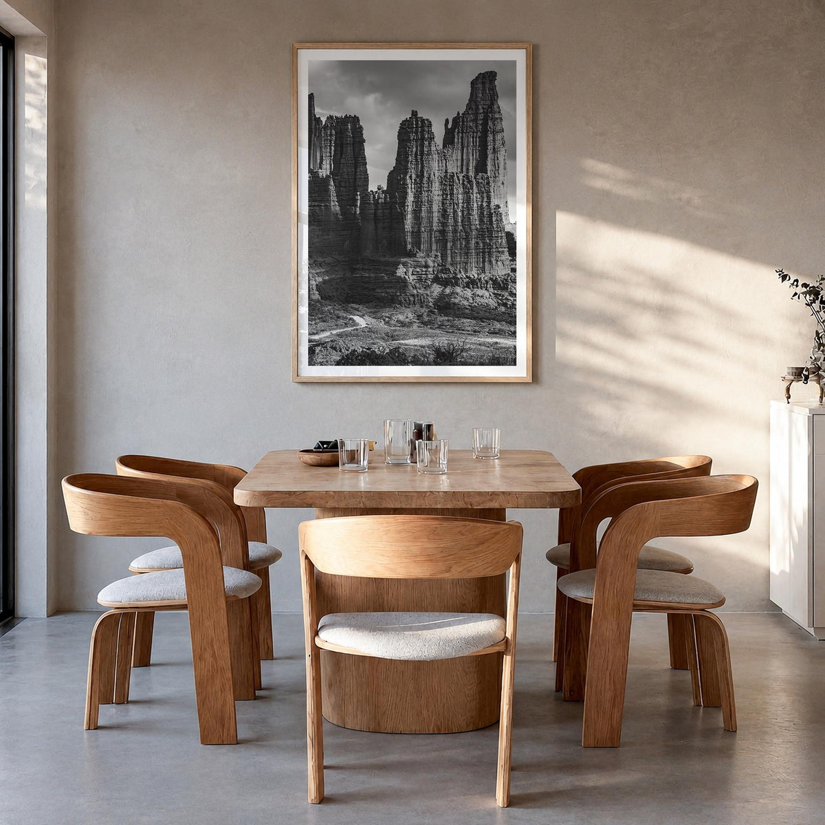 Moab black & white photo poster of Utah, USA – vertical wall art in natural wood frame with white border, hanging on wall