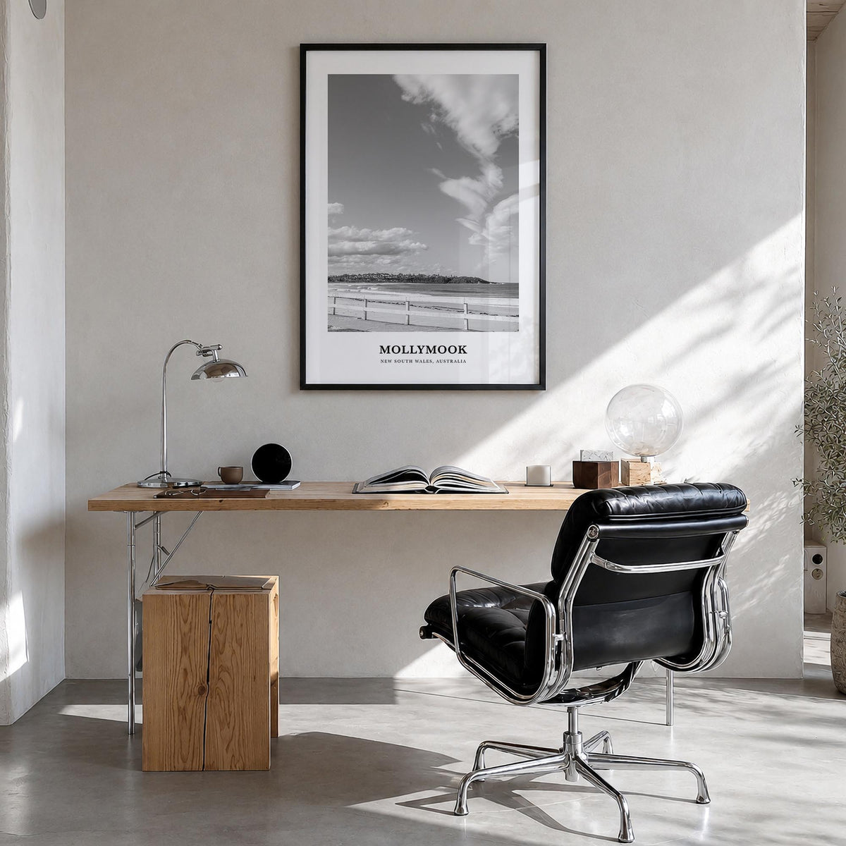 Mollymook black & white classic poster of New South Wales, Australia – vertical wall art in black wood frame, hanging on wall