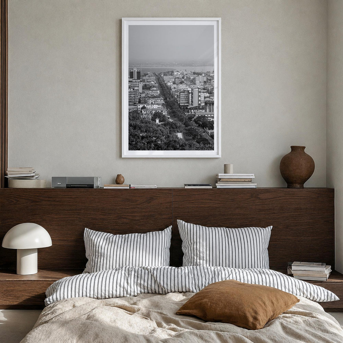 Monrovia black & white photo poster of Liberia – vertical wall art in white wood frame with white border, hanging on wall