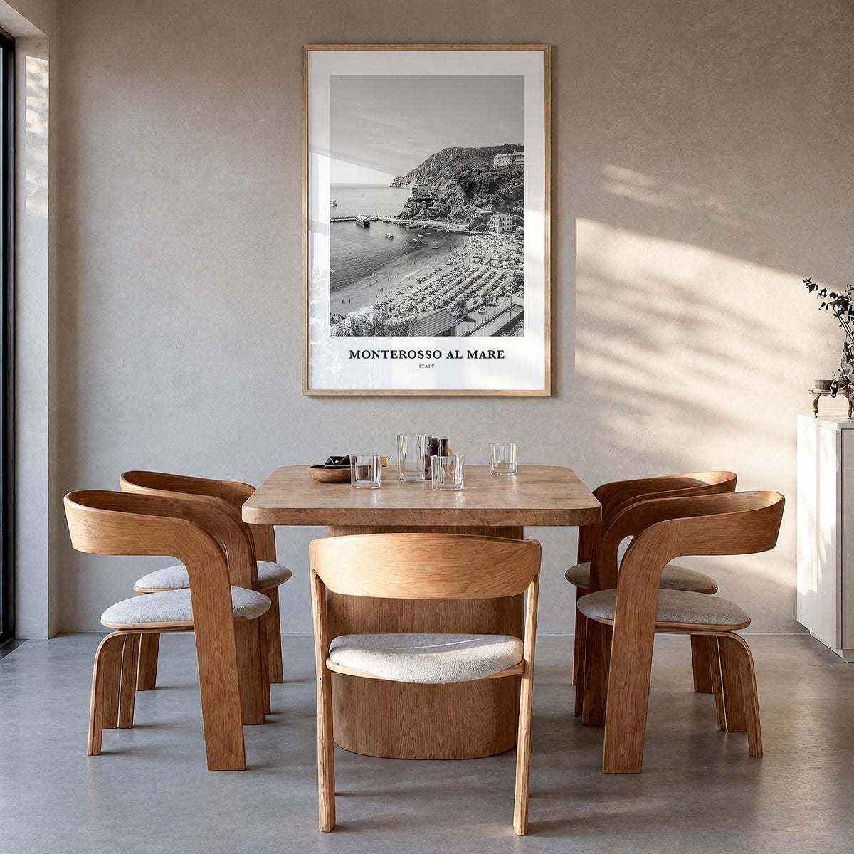 Monterosso al Mare black & white classic poster of Italy – vertical wall art in natural wood frame, hanging on wall