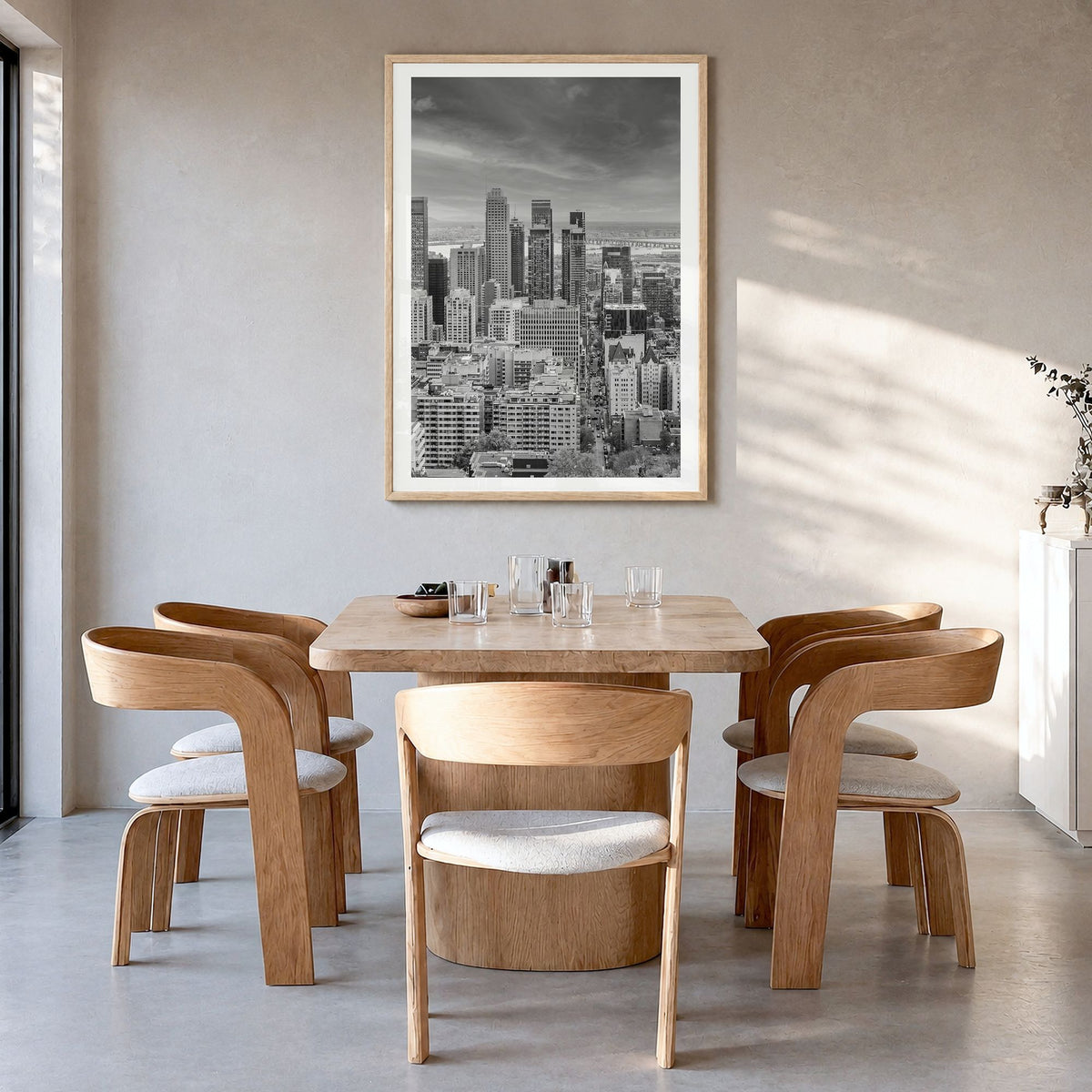 Montreal Photo Poster in a natural wood frame, hanging in a dining room, white border