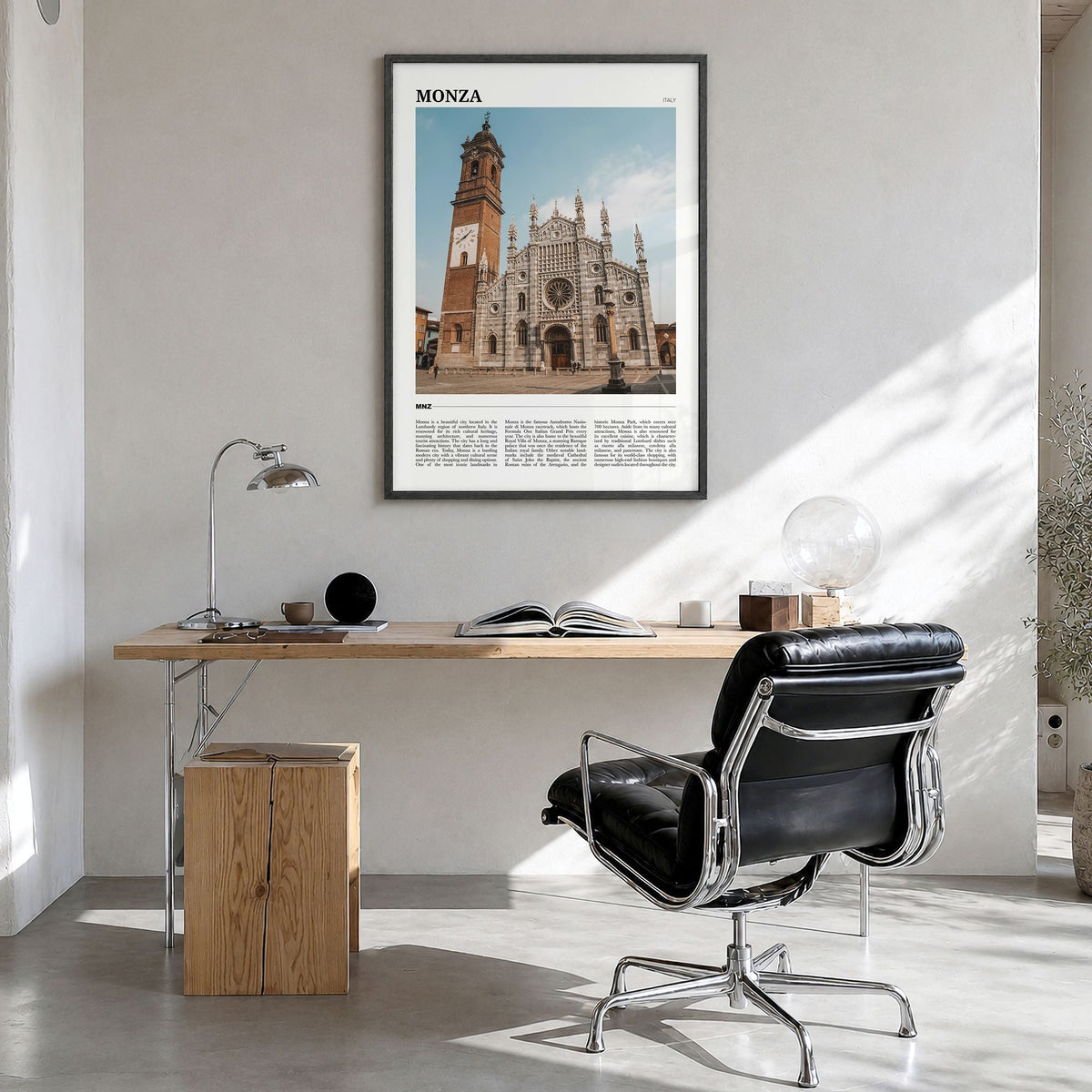 Monza Travel Poster in a black wood frame, hanging in a bright home office