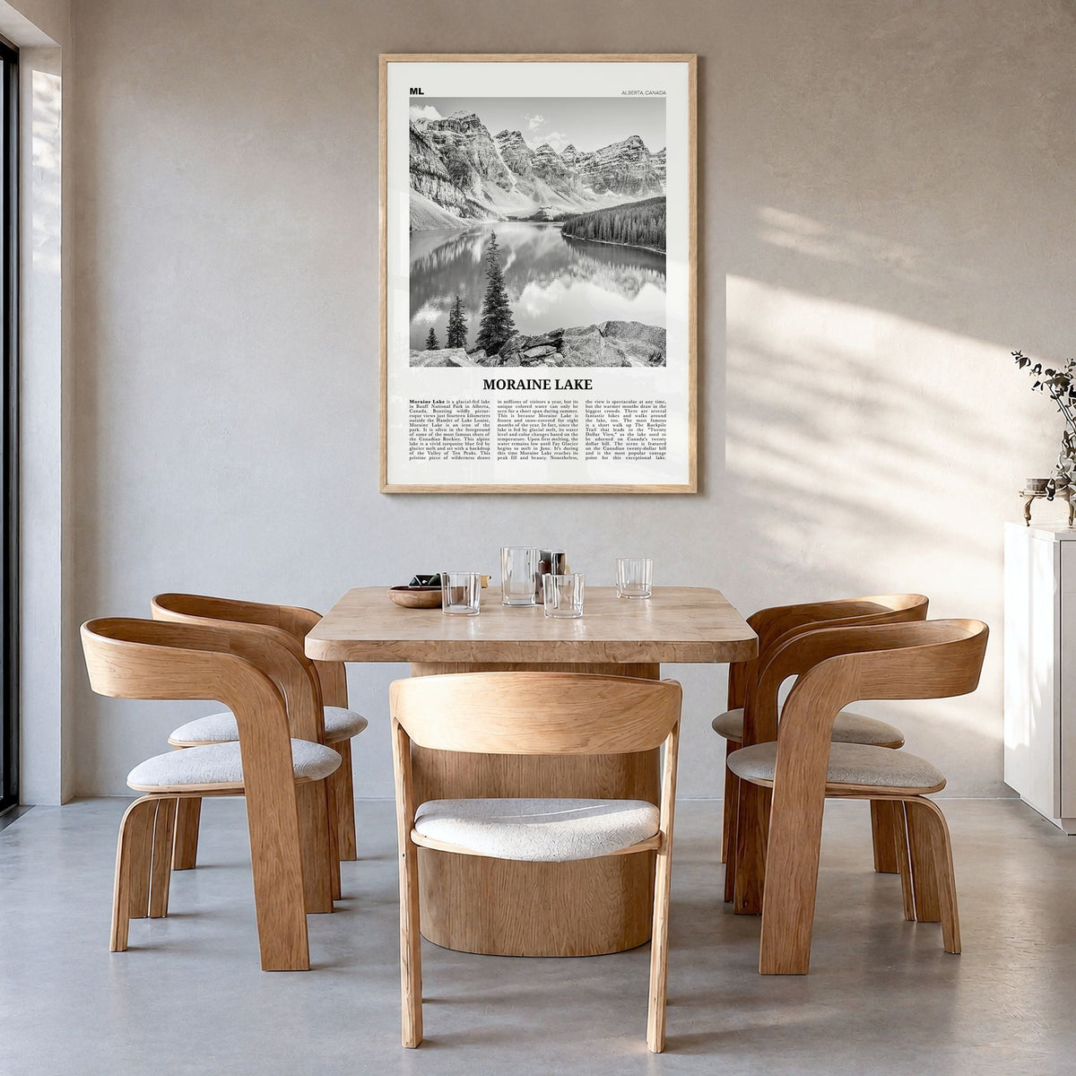 Moraine Lake Newspaper Poster in a natural wood frame, hanging in a dining room