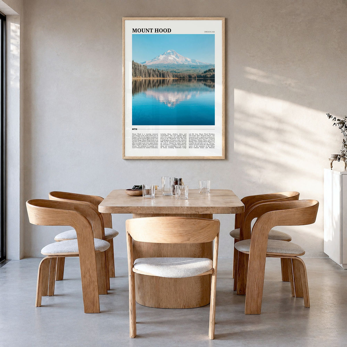 Mount Hood Travel Poster in a natural wood frame, hanging in a dining room