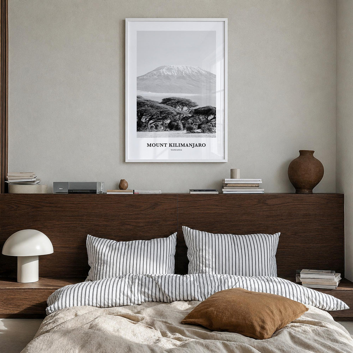 Mount Kilimanjaro black & white classic poster of Tanzania – vertical wall art in white wood frame, hanging on wall