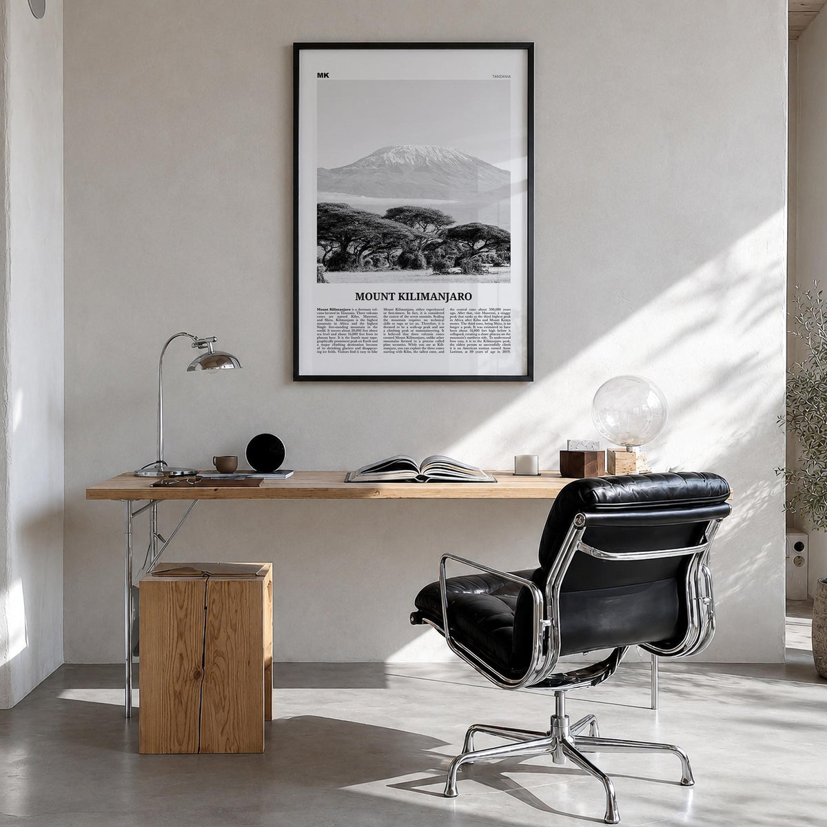 Mount Kilimanjaro black & white newspaper poster of Tanzania – vertical wall art in black wood frame, hanging on wall