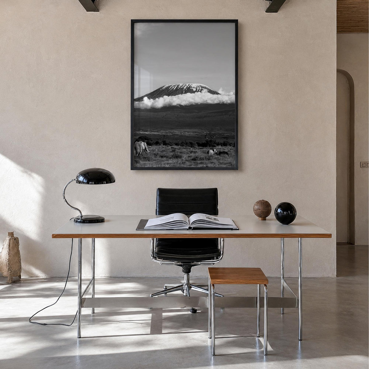 Mount Kilimanjaro black & white photo poster of Tanzania – vertical wall art in black wood frame, hanging on wall
