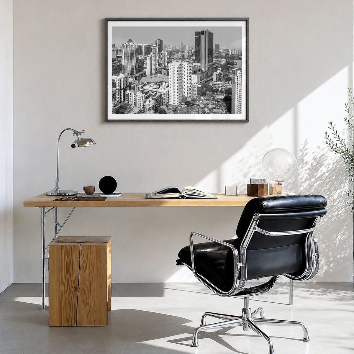 Mumbai Photo Poster in a black wood frame, hanging in a bright home office, white border