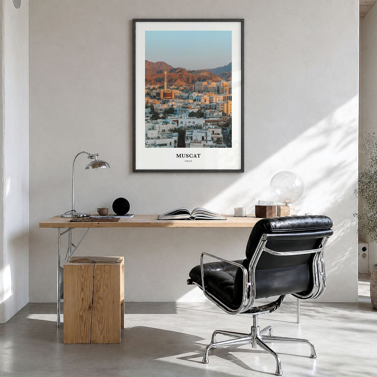 Muscat Classic Poster in a black wood frame, hanging in a bright home office