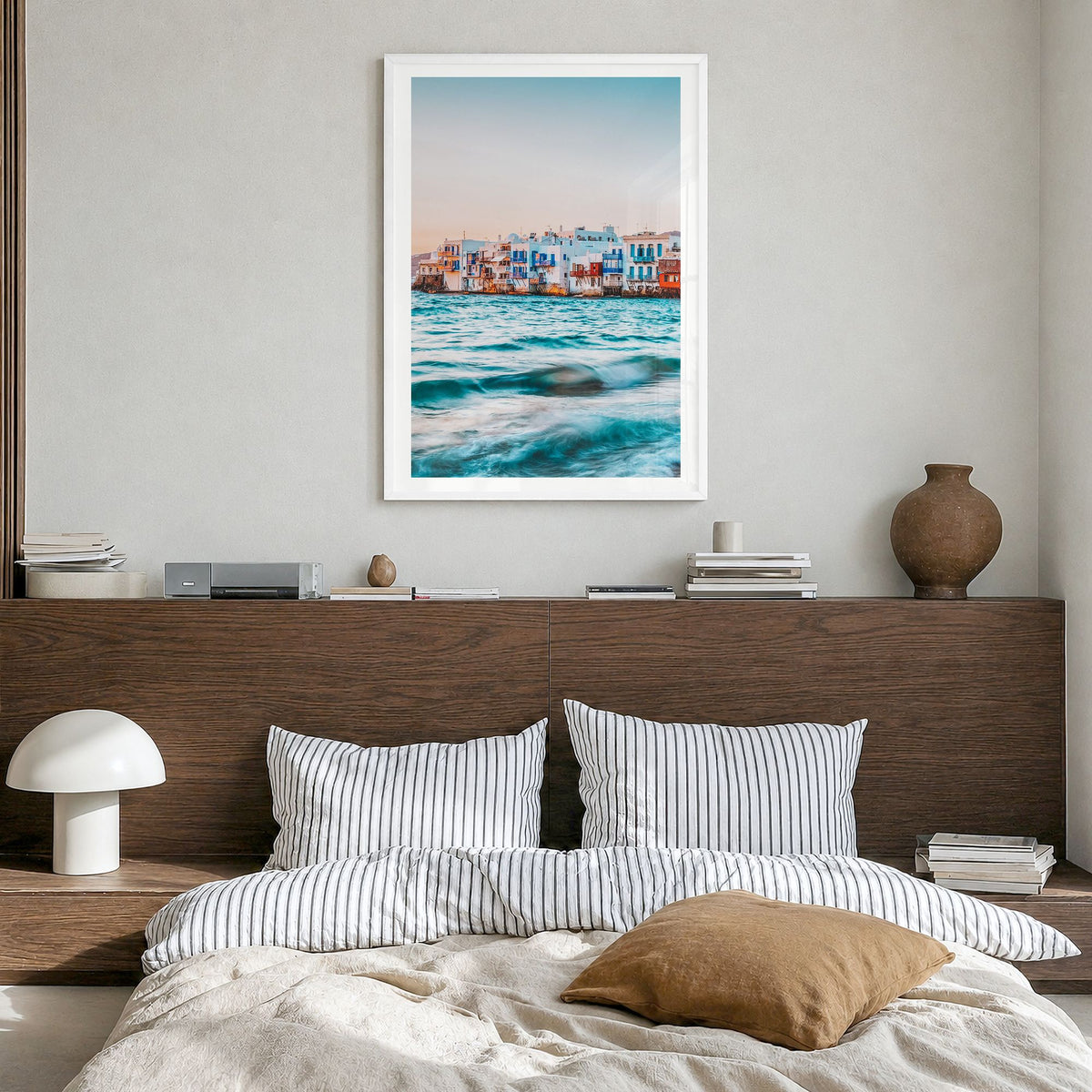 Mykonos Photo Poster in a white wood frame, hanging in a bedroom, white border