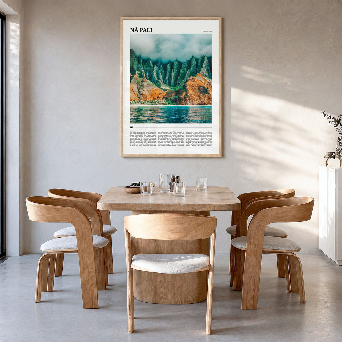 Nā Pali Travel No 2 Poster in a natural wood frame, hanging in a dining room