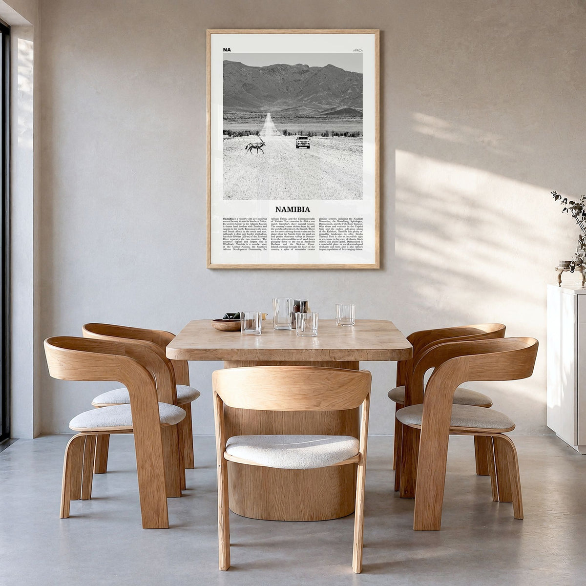 Namibia Newspaper Poster in a natural wood frame, hanging in a dining room