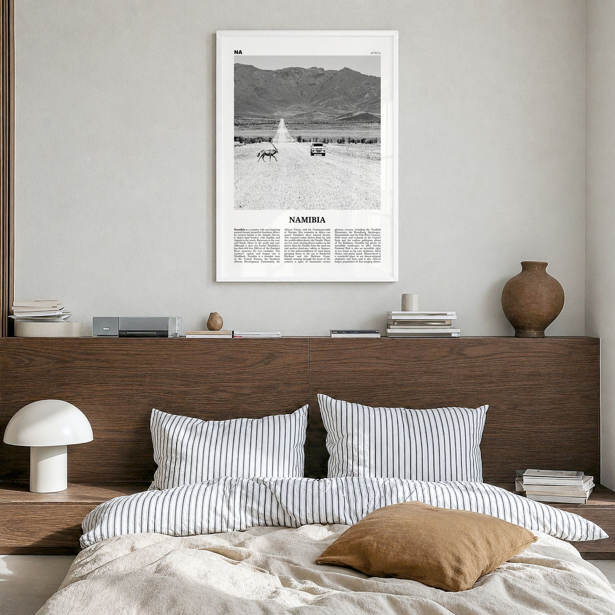 Namibia Newspaper Poster in a white wood frame, hanging in a bedroom
