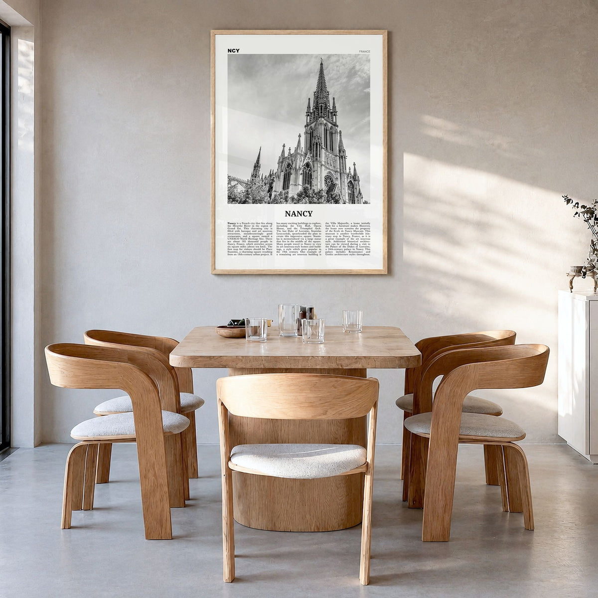 Nancy Newspaper Poster in a natural wood frame, hanging in a dining room