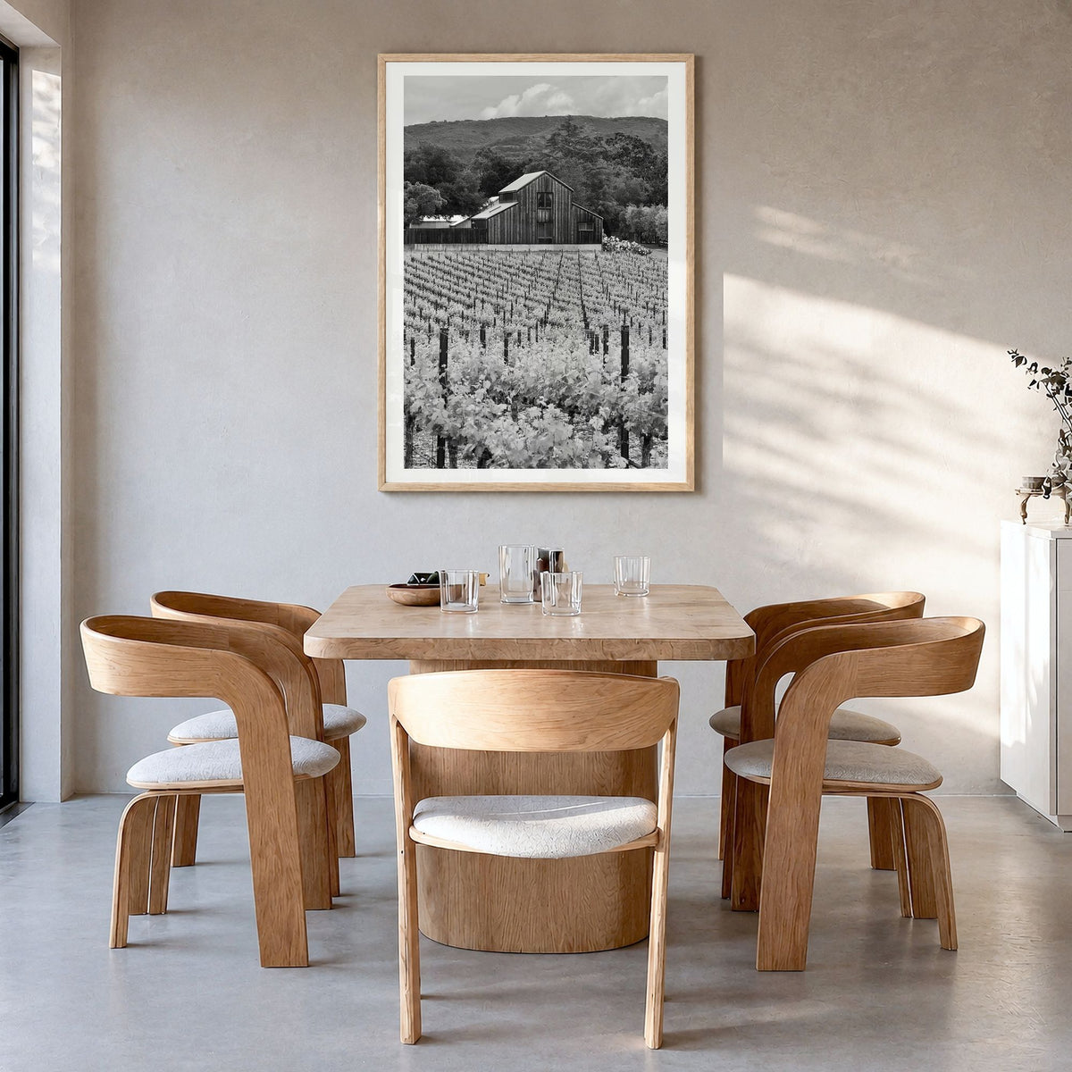 Napa Valley Photo Poster in a natural wood frame, hanging in a dining room, white border