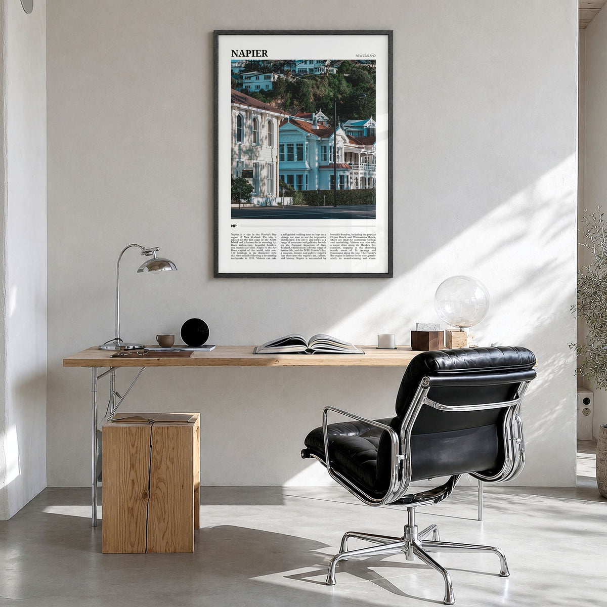 Napier Travel Poster in a black wood frame, hanging in a bright home office