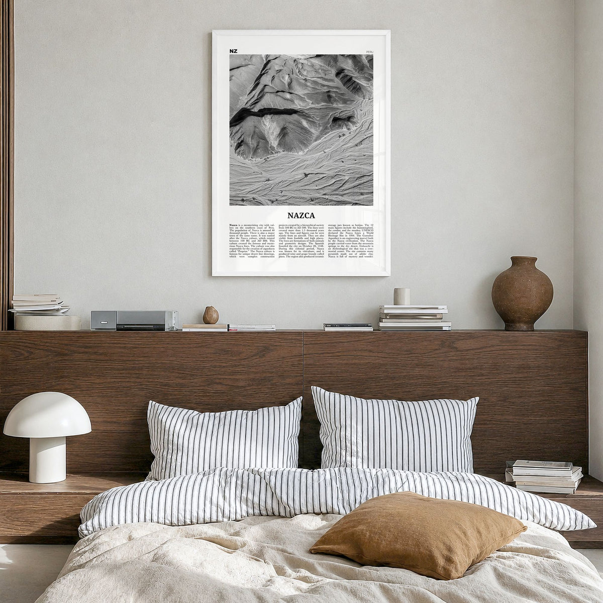 Nazca Newspaper Poster in a white wood frame, hanging in a bedroom