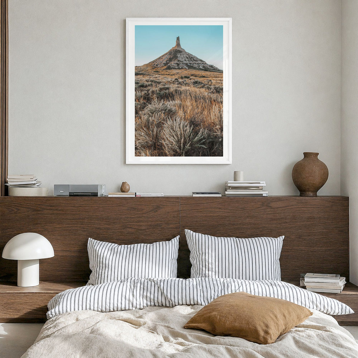 Nebraska Photo Poster in a white wood frame, hanging in a bedroom, white border